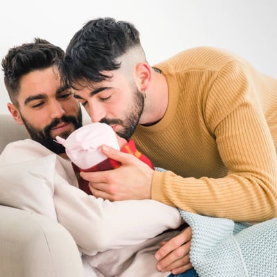 gay couple with baby from surrogacy