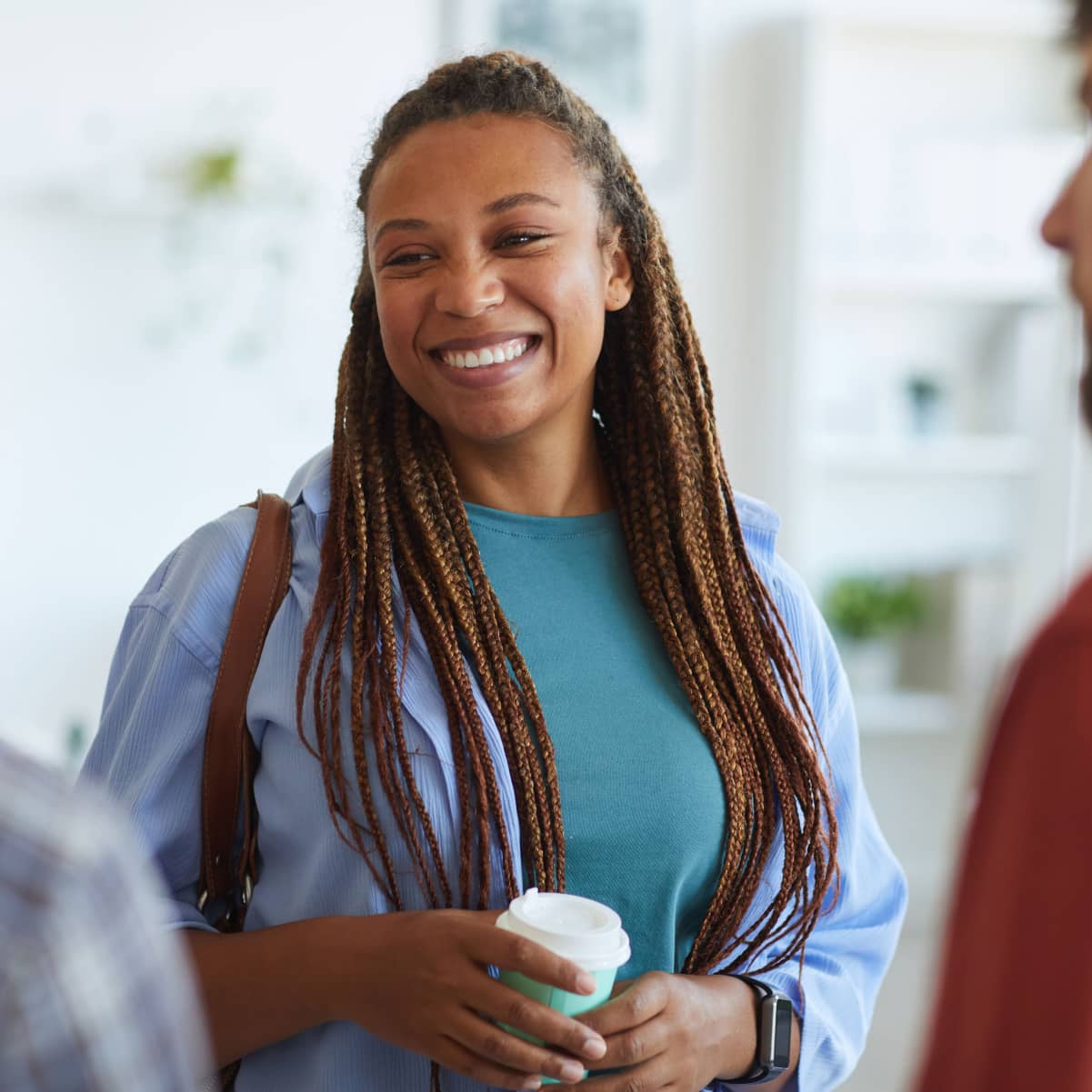 cheerful-african-american-woman-talking-to-colleag-RGEA55R-min